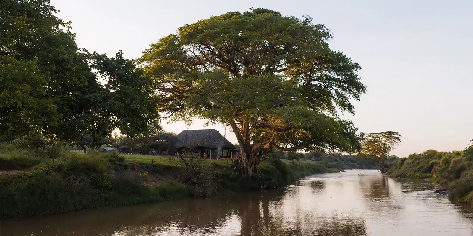 External view of the river and Ol Gaboli Lodge, Kenya.