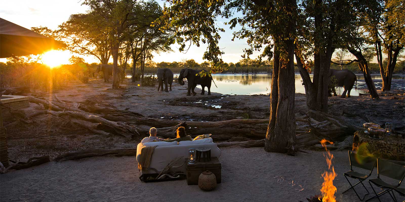 Waterhole at sunset at Hyena Pan Tented Camp in Botswana