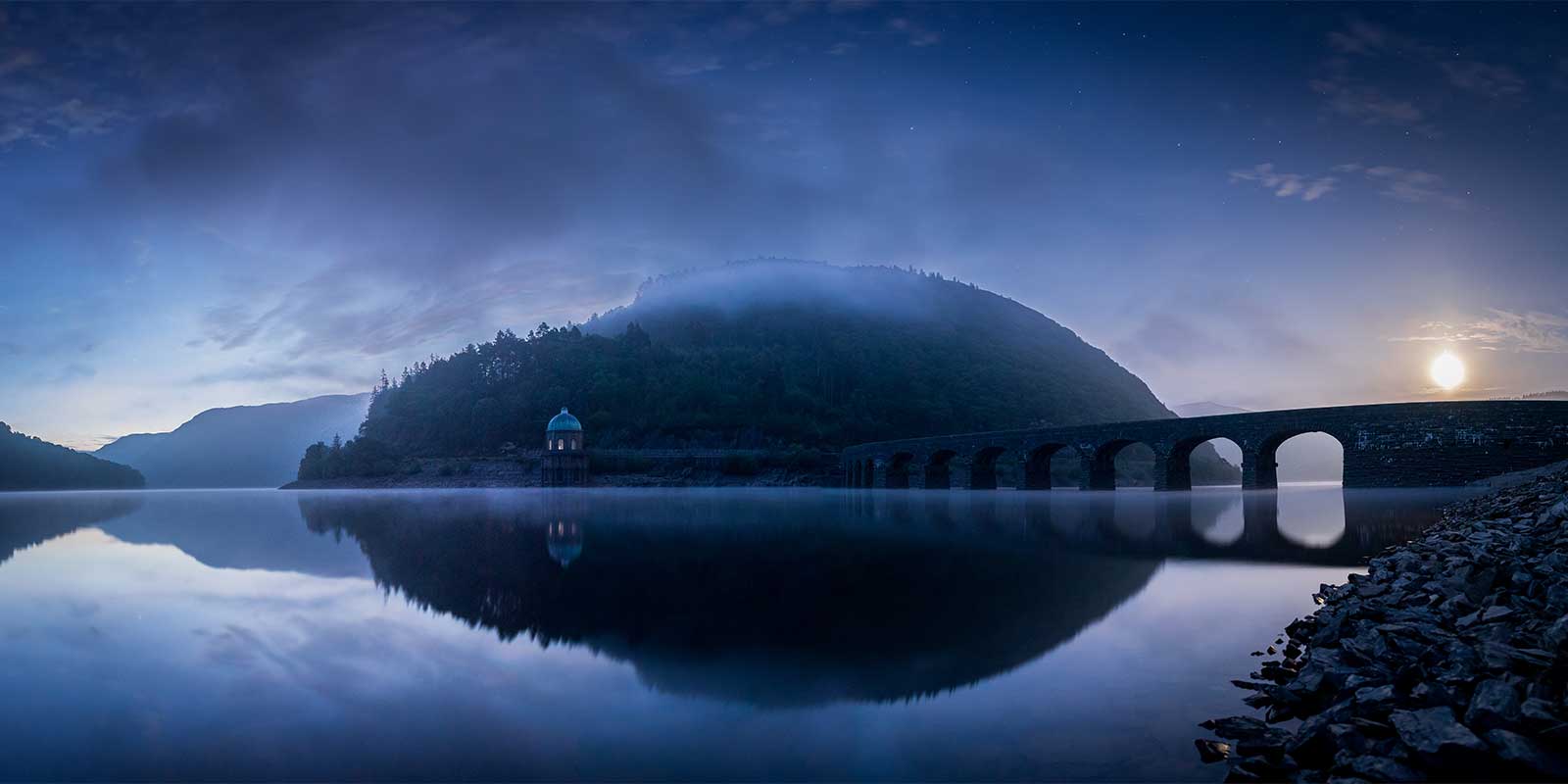 Panorama of moonrise over Garreg Ddu Dam in Elan Valley, Wales.