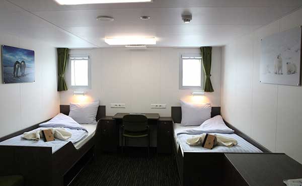 Twin cabin room with windows on Ortelius.