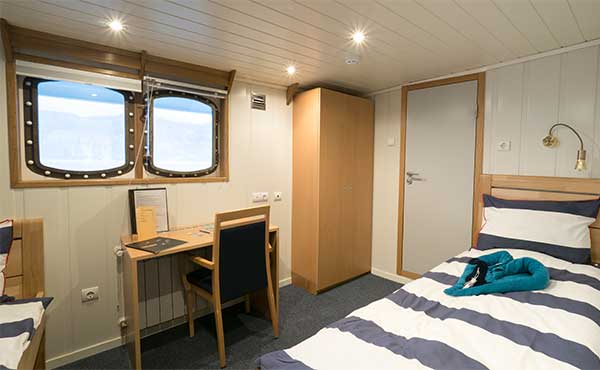 Twin window cabin on board MS Sjøveien in Svalbard.