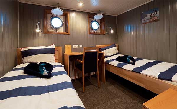 Single porthole cabin on board MS Sjøveien in Svalbard.