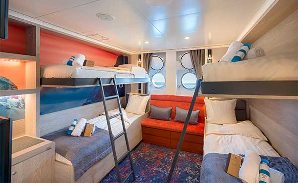 Quadruple porthole cabin on board Hondius polar vessel.