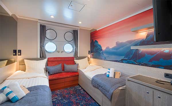 Twin porthole cabin on board Hondius polar vessel.