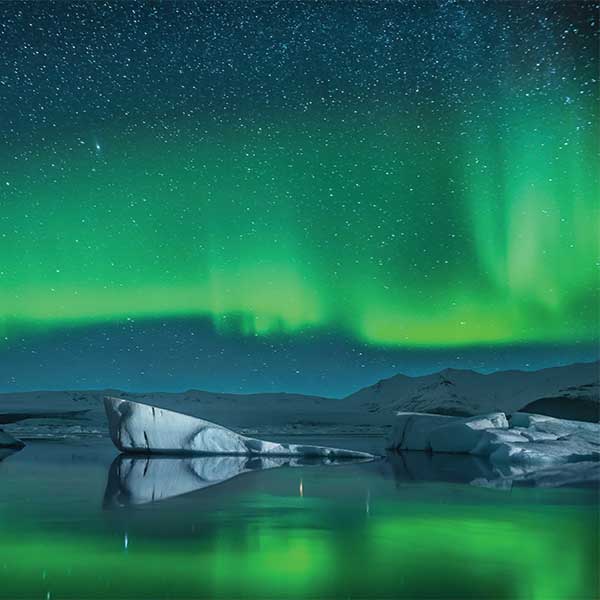 Northern lights and iceberg in Greenland