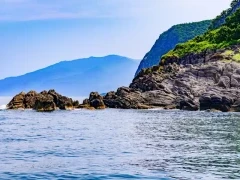 The coastline of Hokkaido, Japan, from the sea.