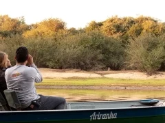 People observing wildlife by boat in the Southern Pantanal.