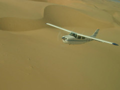 Aircraft flying over the Namibian desert
