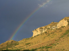 Rainbow behind Golden Gate Highlands National Park in South Africa.