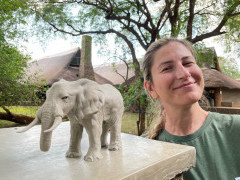 Client with elephant sculpture on our Wildlife Art Safari in South Luangwa, Zambia