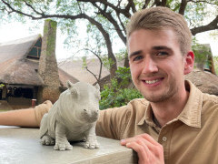 Client with hippo sculpture on our Wildlife Art Safari in South Luangwa, Zambia