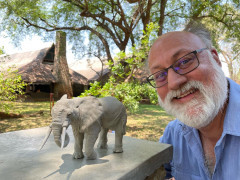 Client with elephant sculpture on our Wildlife Art Safari in South Luangwa, Zambia