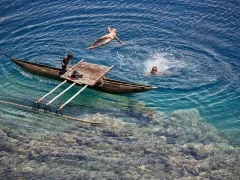 Boys jumping from a platform in Tufi, Papua New Guinea.