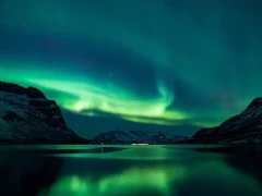 View of the stunning Northern Lights spectacle in the Norwegian Fjords.