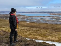 Woman on a tundra walk in Svalbard.