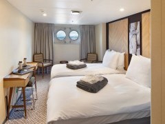 Porthole cabin on board Magellan Explorer.