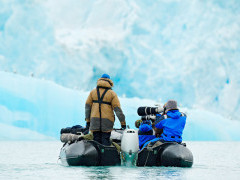 Wildlife photographers on a Zodiac in Svalbard