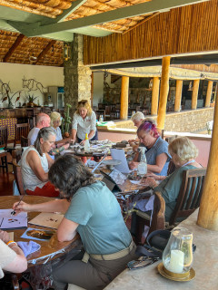 Nick Mackman running a sculpture workshop in Tanzania.