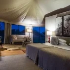 Interior of one of the guest tents at The River Lodge in Kenya, with double bed configuration.