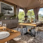 Dining room freshly laid out for guests, at The River Lodge, Kenya, Africa.
