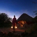 Masai tribe member on evening watch, at Ol Gaboli Lodge, Kenya.