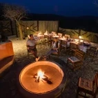 Unwind in the evening around the communal firepit at Etosha Mountain Lodge.