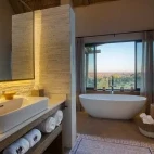 The river view suite bathroom, including bath, at Klaserie Drift Misava Safari Camp.