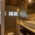One of the en-suite bathrooms with spacious shower, at Klaserie Drift Misava Safari Camp, South Africa.