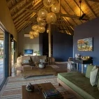 The internal seating area at Klaserie Drift Misava Safari Camp,  with views of the nature reserve.