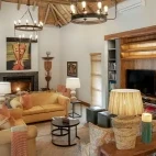 Lounge area at Simbavati Camp George in South Africa. Relax and unwind here by the fire.