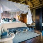 An interior of one of the en suite rooms at nThambo Tree camp, with large bed and ample space to relax.
