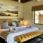 View of the king bed available at Senalala Safari Lodge.