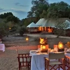 Bush dining set up for the evening at Hamiltons Tented Camp, South Africa.