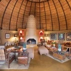The cosy lounge area at Hoyo Hoyo Safari Lodge, with open fire.