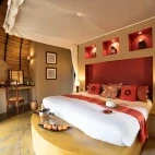 One of the suites at Hoyo Hoyo Safari Lodge, with view of the bush.