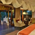 View of a suite with private dining area on the decking, Imbali Safari Lodge.