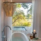View from the bath looking out to the private decking and plunge pool.