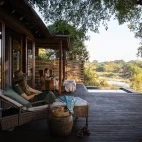 Guests enjoying the view from their private deck area, Dulini River Lodge, Sabi Sands Game Reserve.