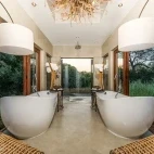 Sabi Sabi Bush Lodge Safari's luxury villa bathrooms, featuring two baths.