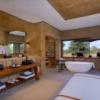 View of the large main bathroom in Amber Villa, at Sabi Sabi Earth Lodge, South Africa.