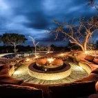 The luxury firepit at Sabi Sabi Earth Lodge, overlooking a watering hole - perfect for relaxing after an afternoon on safari to watch the local wildlife.