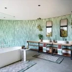 Guest bathroom at Tanda Tula, with freestanding bath and his & hers sinks