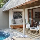 Covered private lounge area and private plunge pool, leading to the bedroom of the suite at Varty Camp in South Africa