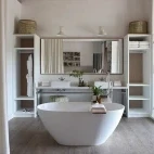 Freestanding bath and shower cubicle in one of Varty Camp's suites in South Africa