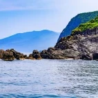The coastline of Hokkaido, Japan, from the sea.