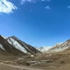Mountains under blue skies in the Gouli Valley, Qinghai, China.