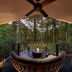 The outdoor seating area for the billabong suite at dusk, at Silky Oaks Lodge, Australia.