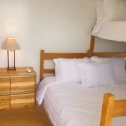 View of an economic room with double bed and bunk bed, at Naturezas, Brazil.