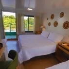 View of a standard room with two beds, at Naturezas, Brazil.