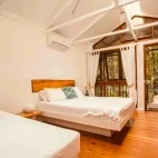A twin bedroom at Daintree Wilderness Lodge, Australia.